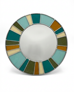 Round mirror with a colorful, multicolored frame on a white background